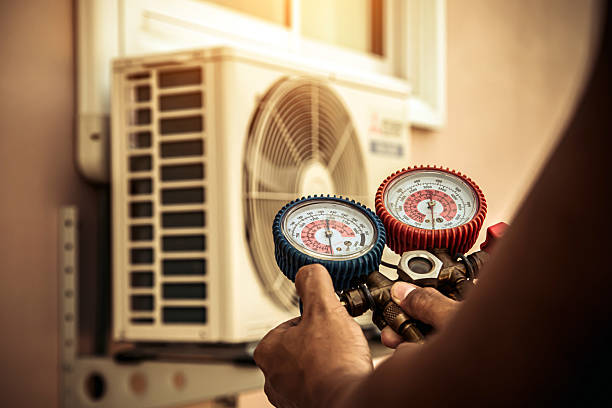 Professional Air Conditioning Service technician working in Glencoe, MO